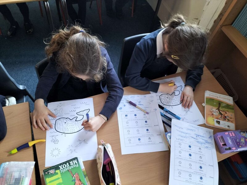 Children doing writing activities in classroom
