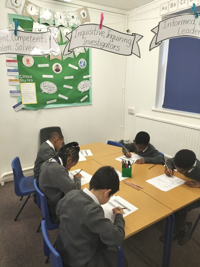 Students working on handwriting exercises