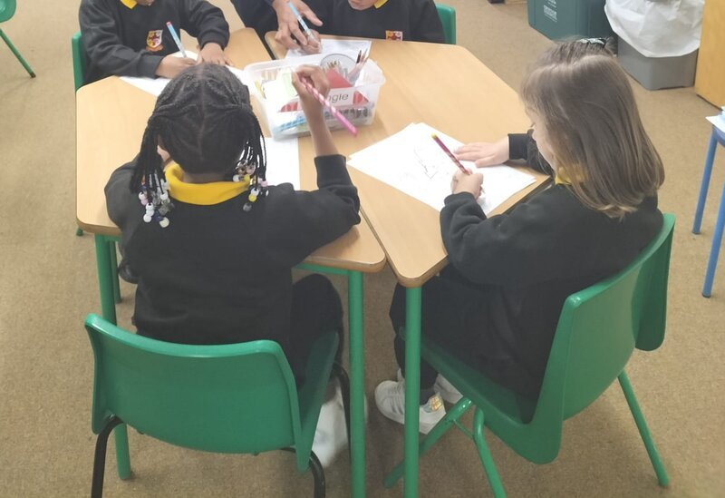 Children engaged in writing workshop